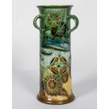 C H Brannam, Barum, three handle vase, decorated with a bird amongst foliage, signed and dated 1906,