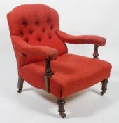 A Victorian button back armchair, late 19th century,