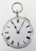 A white metal open face pocket watch. Circular white dial with roman numerals.