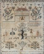 An early 19th century Sampler with alphabet, floral sprays,