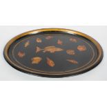 A 19th century Toleware oval tray, later decorated with decoupage work and shells,