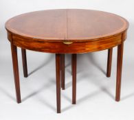 An early nineteenth century cross banded D-end demi-lune dining-table,