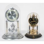 A 1960's silvered brass anniversary clock, under glass dome, 30cm high inc dome,