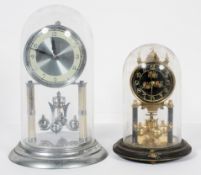 A 1960's silvered brass anniversary clock, under glass dome, 30cm high inc dome,