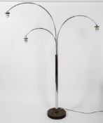 A 1970's chrome three light arc floor lamp, each adjustable lamp with turn screw angle,