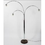 A 1970's chrome three light arc floor lamp, each adjustable lamp with turn screw angle,