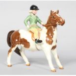 A Beswick Horse and rider figure, 'Girl on a Pony', Skewball, model No 1499,