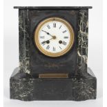 A Victorian black slate and marble mantle clock, applied with a brass presentation plaque,