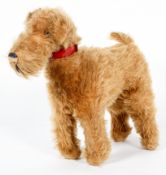 A Chiltern plush toy dog, early 20th century, bearing red label,