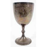 A large silver Chalice style trophy, engraved with panels of foliate strapwork to the bowl,