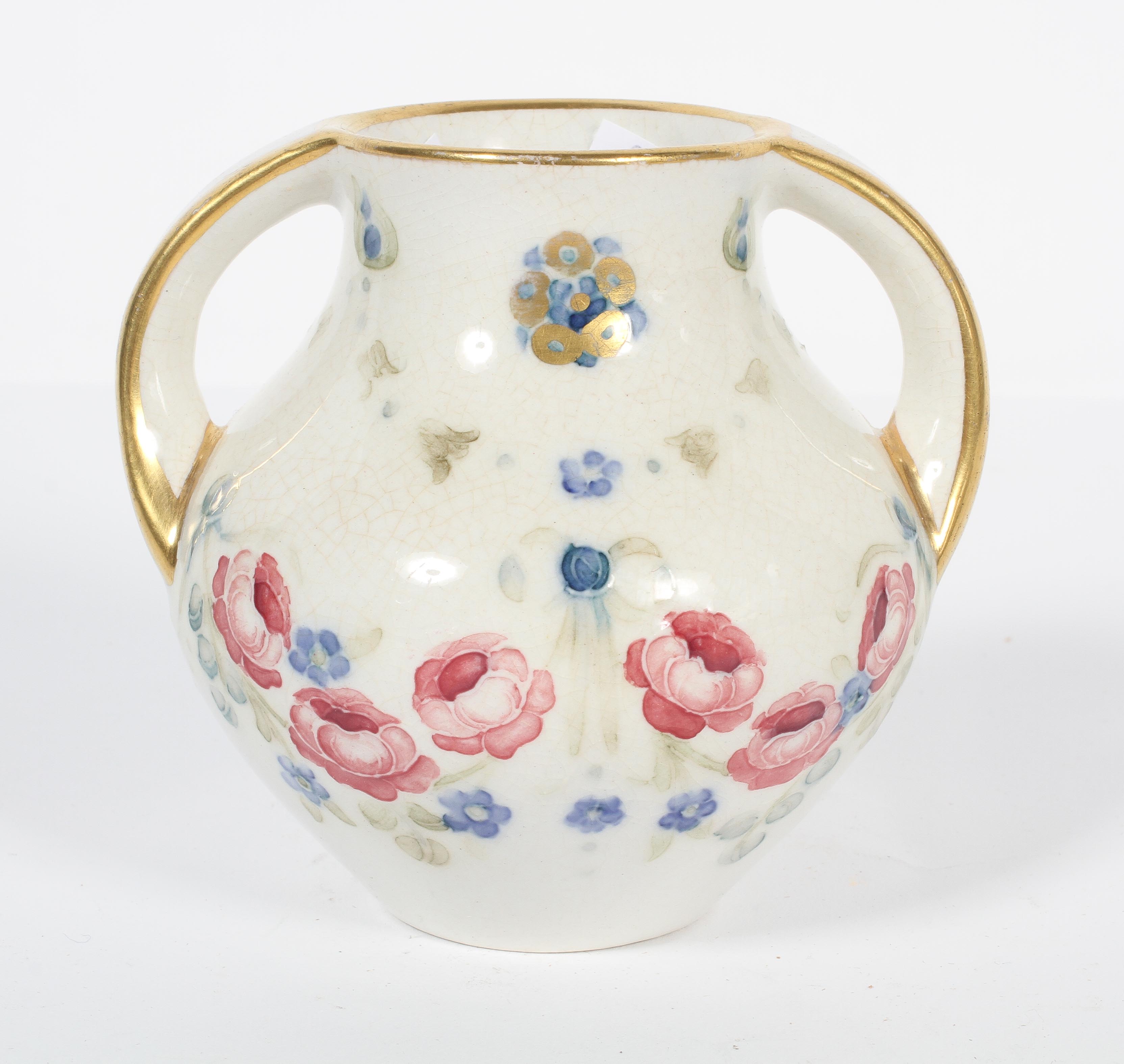 A Macintyre Florian ware two handled vase, with floral swags,