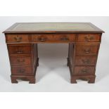 A George III reproduction mahogany twin pedestal desk,