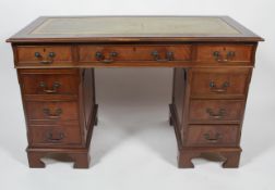 A George III reproduction mahogany twin pedestal desk,