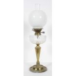 A Victorian brass and glass oil lamp, with clear chimney and opaque globe shade,