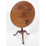 An 18th century tripod table,