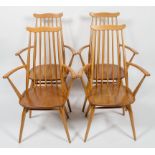 Four Ercol pale beech stick back kitchen armchairs, each with curved top rail and arms,