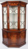 A reproduction George III style mahogany glazed display cabinet, of canted D-section,