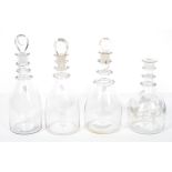 Three similar Georgian style three ring neck decanters, of mallet form, with teardrop stoppers, 30.