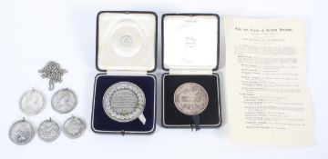 Two boxed technological medals,