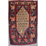 An Iranian 20th century wool rug, with central beige medallion, with blue,