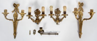 Two pairs of gilt metal twin wall lights, 20th century, the first of neo-Classical form,