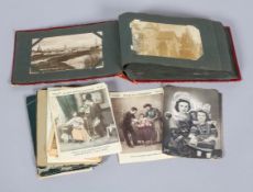 A collection of vintage postcards and an album,