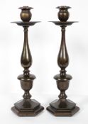 A pair of bronzed metal lamp bases, of 18th century form,