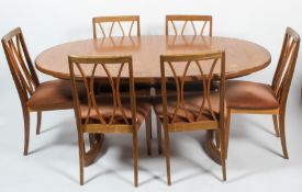 A G-plan teak extending dining table and six dining chairs, circa 1970, the table of oval form,