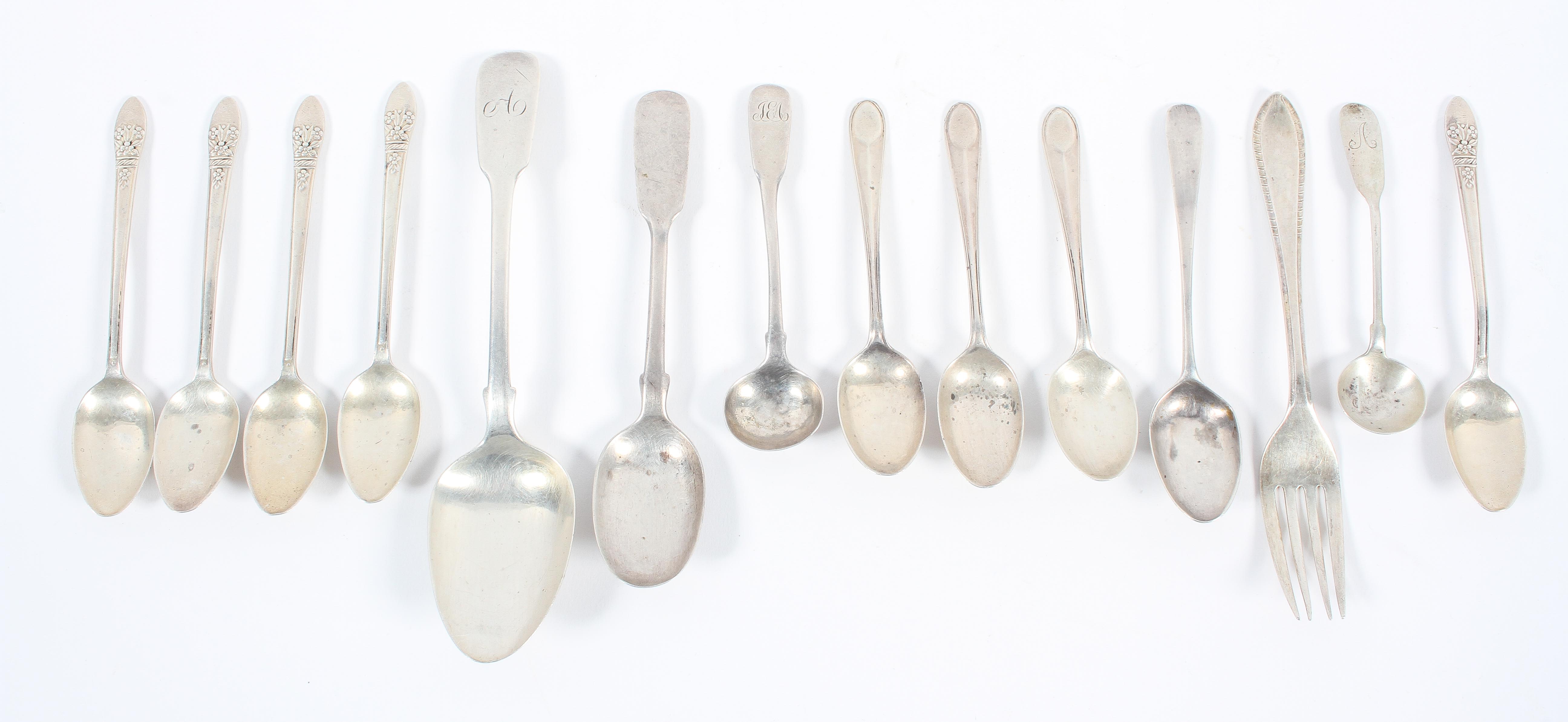 A silver fiddle pattern dessert spoon, London 1834, 17cm high; with a collection of tea spoons,