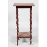 A Victorian mahogany two-tier stand with turned baluster supports and feet,