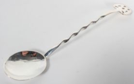 A silver Arts & Crafts style jam spoon, with wrythen stem, and pierced terminal, Birmingham 1902,