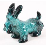 An Italian 1960's retro vintage pottery Scottish terrier, in a black and green glaze,