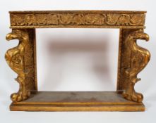 A gilt wood console table, in the manner of William Kent, with two eagle mono podae,