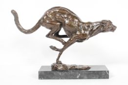 20th century school, Running cheetah, brown patinated bronze on a black marble base,