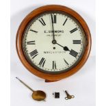 A walnut circular wall clock, the 11 1/2" painted dial inscribed E Simmonds/318 York Rd/Wandsworth,