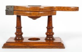 Kitchenalia : An oak fruit press, on turned supports with silver plated mounts,