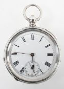 A white metal open face pocket watch. Circular white dial with roman numerals.