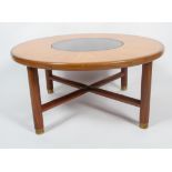 A G-plan 1970's glass mounted circular teak framed coffee table,