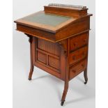 A Edwardian walnut davenport, set a top compartment with hinged stationery rack,