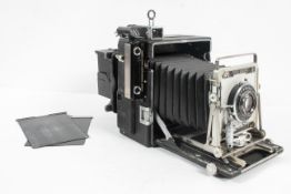 A Graflex 4" x 5" large format still picture camera, type C-6, with Kalart synchronizer range finder
