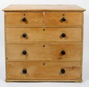 A Victorian pine chest of drawers, with two short drawers above three graduated long drawers,