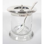 A clear glass jam pot, of cylindrical form, with star cut base, with an applied silver everted rim,