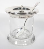 A clear glass jam pot, of cylindrical form, with star cut base, with an applied silver everted rim,