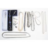 A collection of jewellery to include: A silver 925 heavy curb bracelet; Two silver 925 chains;