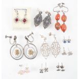 A collection of ten pairs of earrings of variable designs. Some are marked for silver 925.