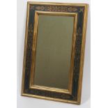 A mirror in polished Florentine frame,