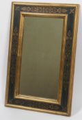 A mirror in polished Florentine frame,