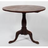 A Georgian mahogany circular occasional table, on a tripod base,