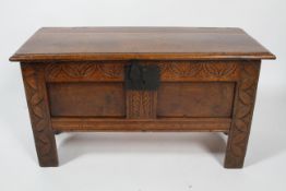 An oak coffer, 18th century and later, of rectangular form,