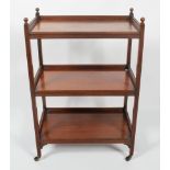 A 19th century mahogany three tier rectangular tea trolley, with reeded gallery,
